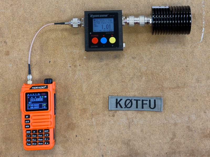 Measuring transmit power of an orange TIDRADIO H9 using a Surecom SW-102 and a dummy load
